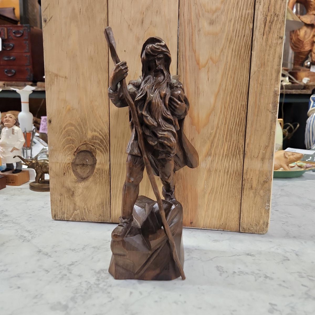 WOOD CARVING OF SOJOURNER WITH STAFF
